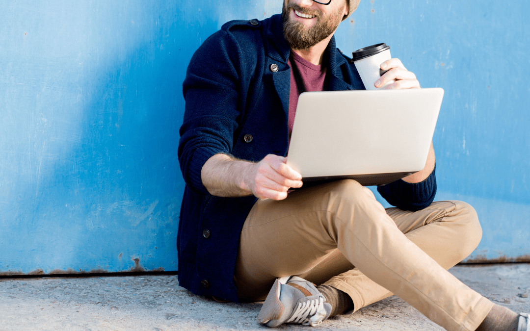 Hipster trying out Xero features on his laptop