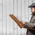 Man sorting out finances on abacus after receiving VAT return advice