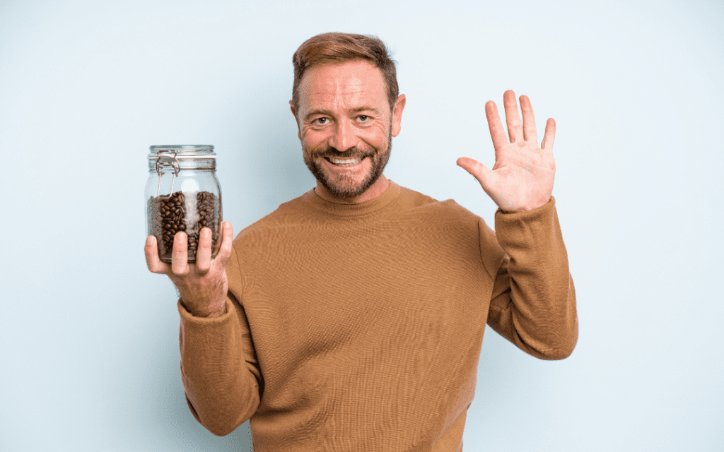 Man counting beans in a jar