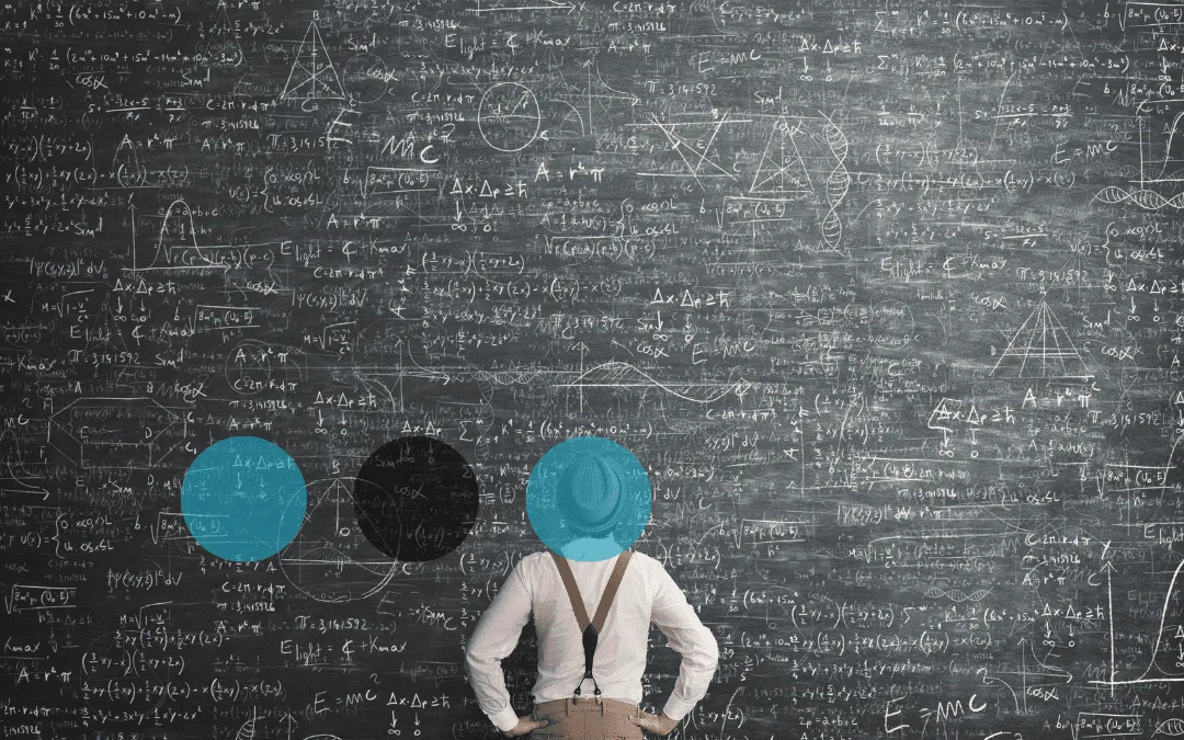 Man stood in front of complicated maths blackboard