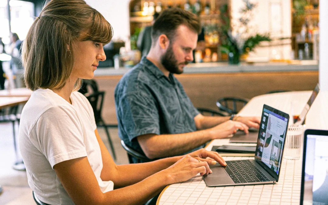 Two Creative Agency Employees Creative Agency Employees working at a desk