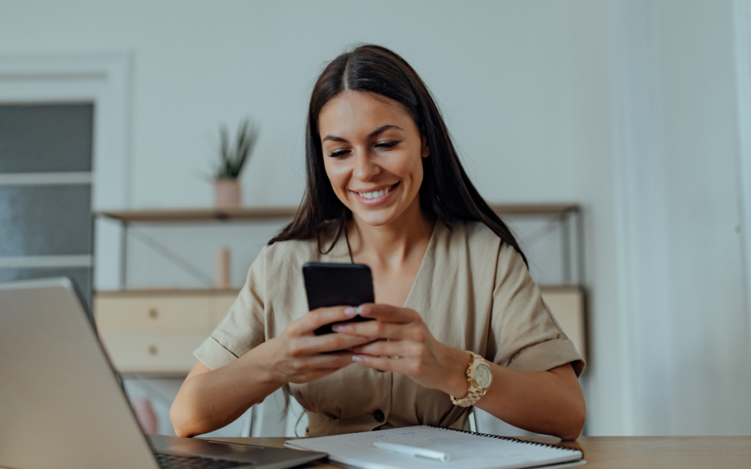 A women smiling after growing her accounting business with the help of a business coach.