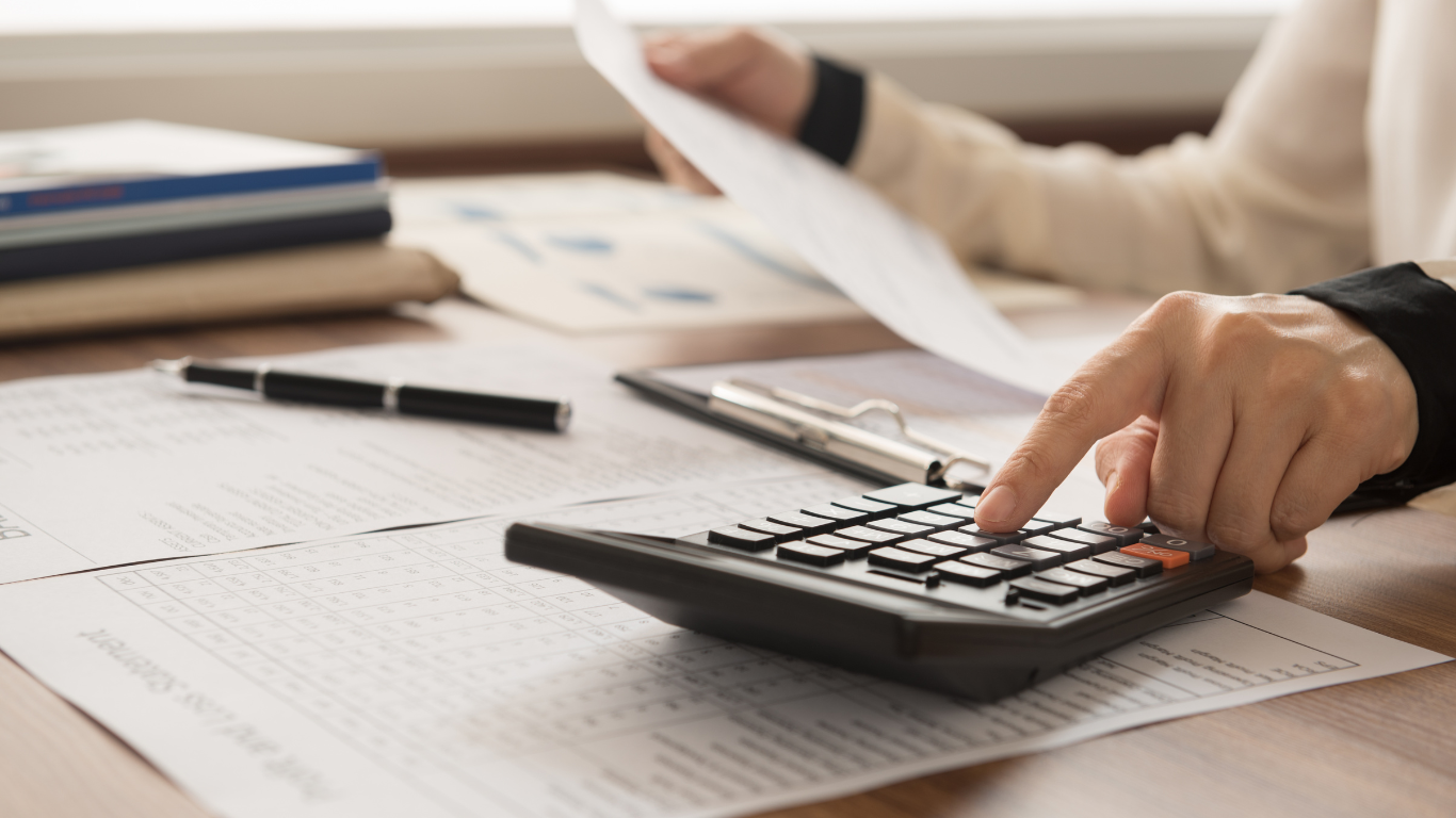 An accountant at their desk after getting advice from a business coach for accountants. 