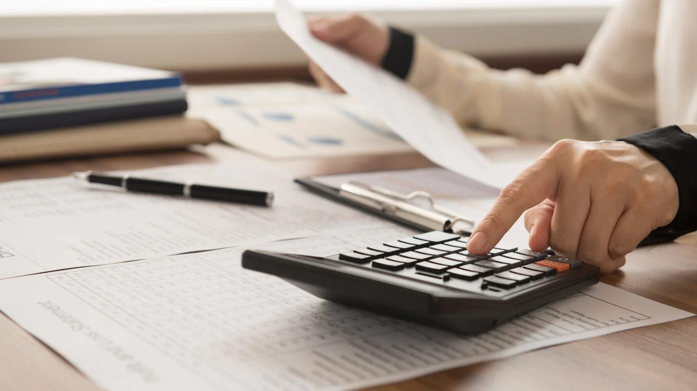 Raedan Blogs (3) An accountant at their desk after getting advice from a business coach for accountants.