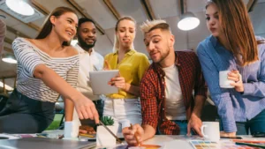 A group of people discussing how to set up a creative agency.