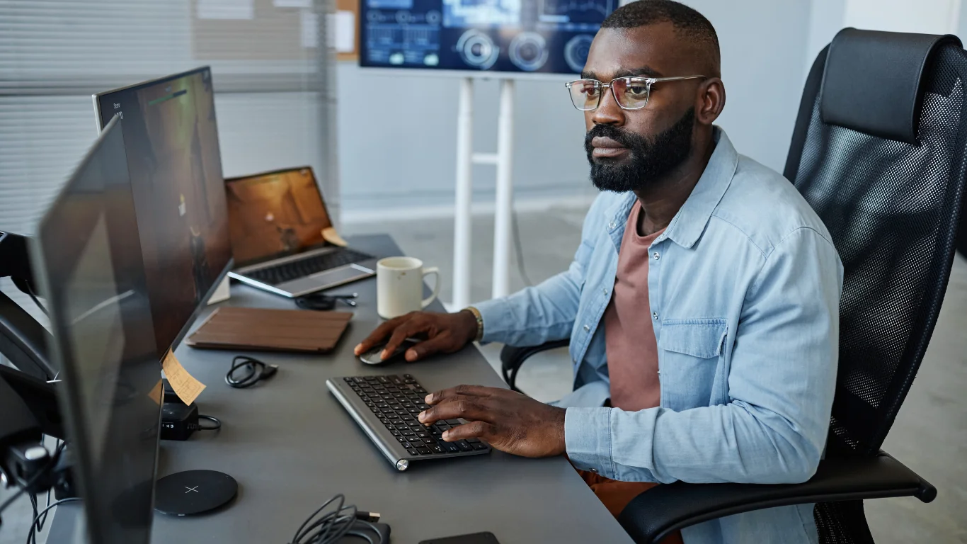 Advertising Agency Employees A gaming designer working on a project