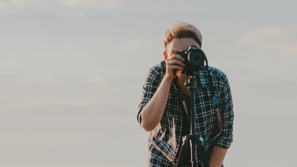 A photographer behind the camera