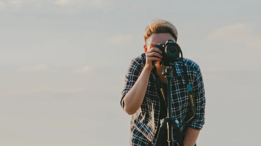 A photographer behind the camera